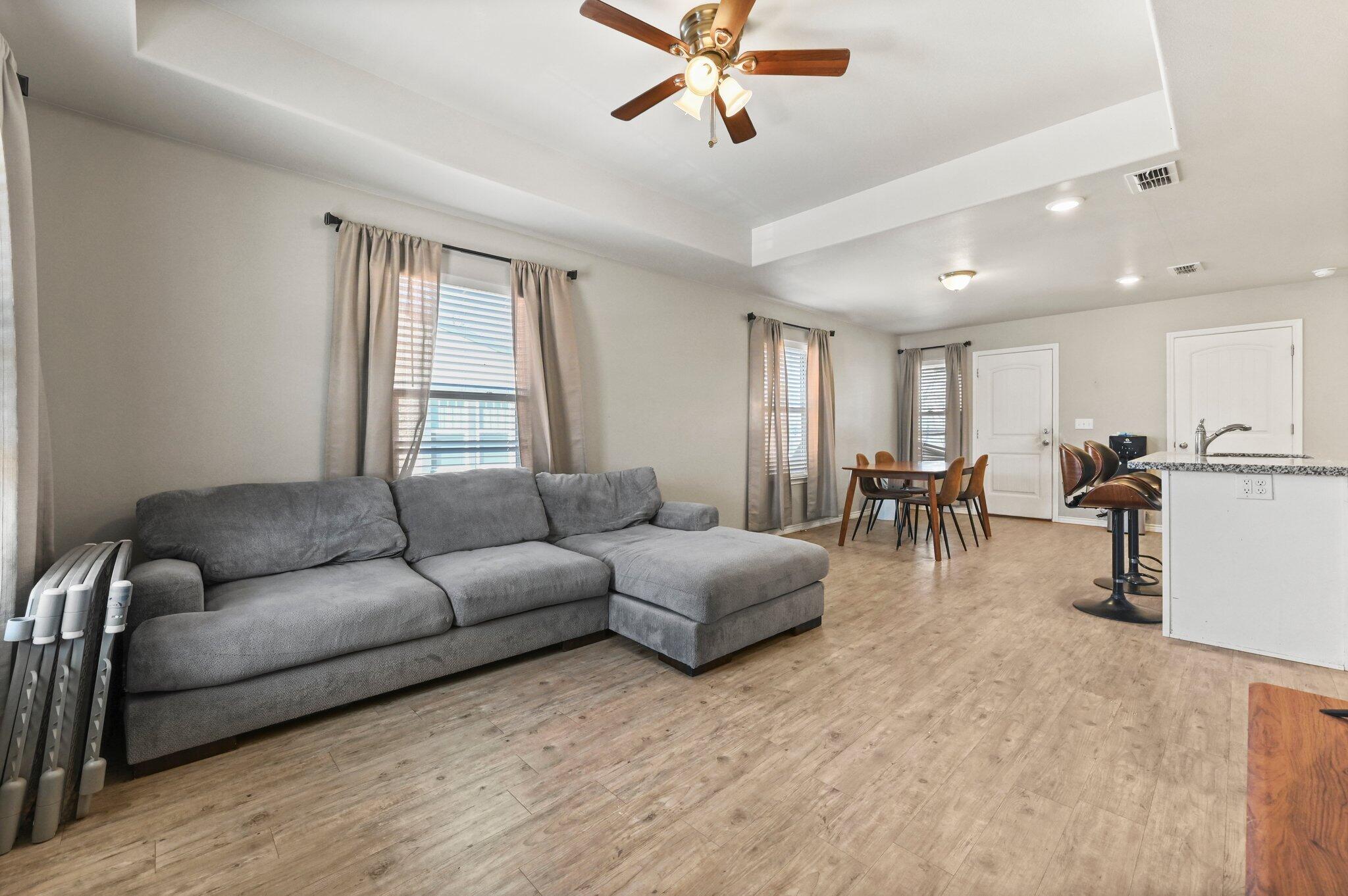 2116 24th Street, Unit 1 Lubbock, TX 79411 - Photo 2 of 13 a living room with furniture and a window