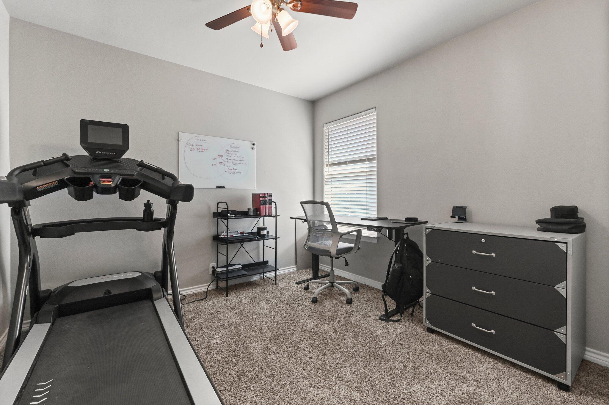 2116 24th Street, Unit 1 Lubbock, TX 79411 - Photo 9 of 13 a view of a workspace with furniture