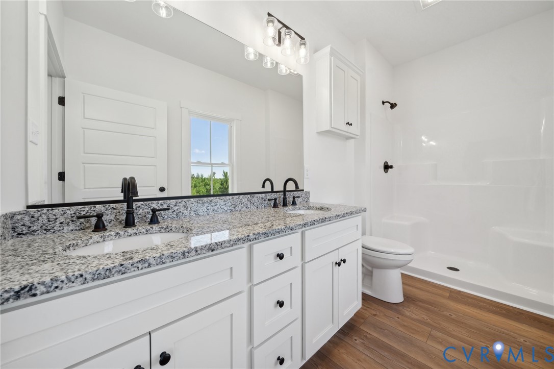 Lot 1 Oak Hill Road Cumberland, VA 23040 - Photo 15 of 26 a bathroom with a granite countertop sink and a mirror