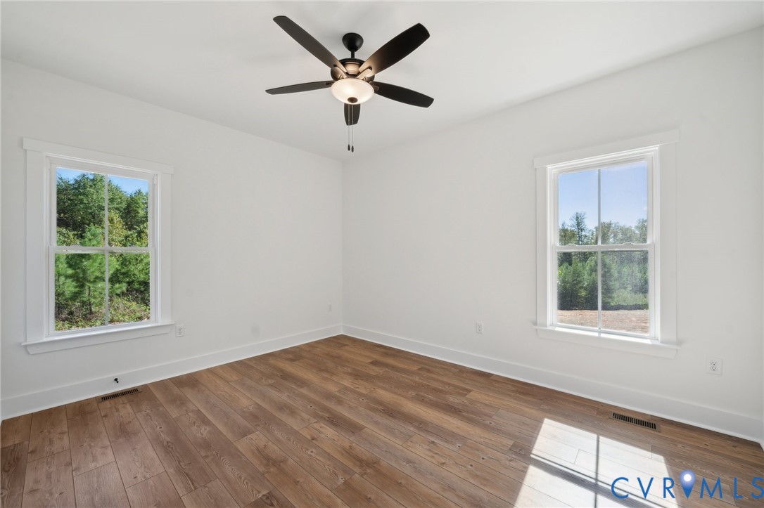 Lot 1 Oak Hill Road Cumberland, VA 23040 - Photo 17 of 26 a view of a big room with wooden floor and windows