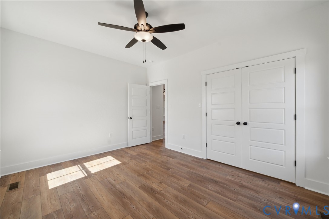 Lot 1 Oak Hill Road Cumberland, VA 23040 - Photo 18 of 26 a view of room with hardwood floor and ceiling fan