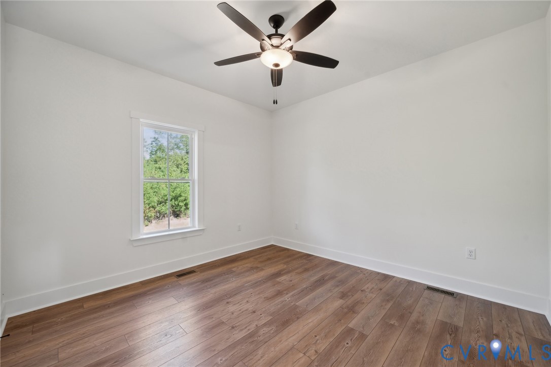 Lot 1 Oak Hill Road Cumberland, VA 23040 - Photo 20 of 26 an empty room with a window and a fan