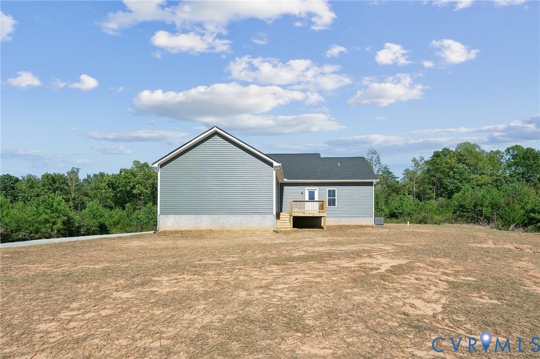 Lot 1 Oak Hill Road Cumberland, VA 23040 - Photo 25 of 26 a backyard of a house with table and chairs