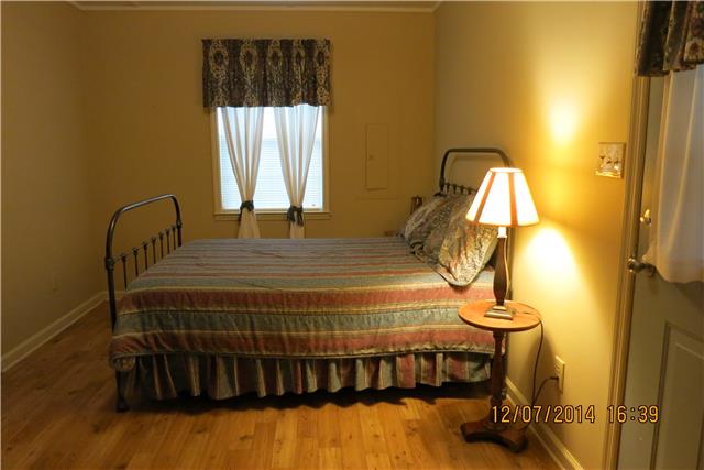5323 Wiley Hollow Road Culleoka, TN 38451 - Photo 18 of 20 Guest house bedroom has a outside door to the back porch.