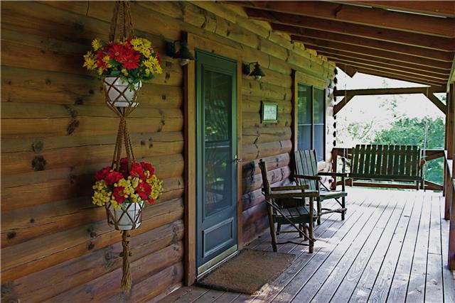 5323 Wiley Hollow Road Culleoka, TN 38451 - Photo 2 of 20 Walk on to the full length porch and enjoy the serenity of this country living while sitting on your swing.