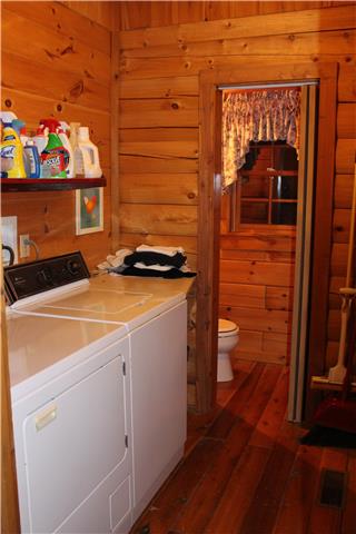 5323 Wiley Hollow Road Culleoka, TN 38451 - Photo 6 of 20 The nice laundry room area with a 1/2 bath at the end.