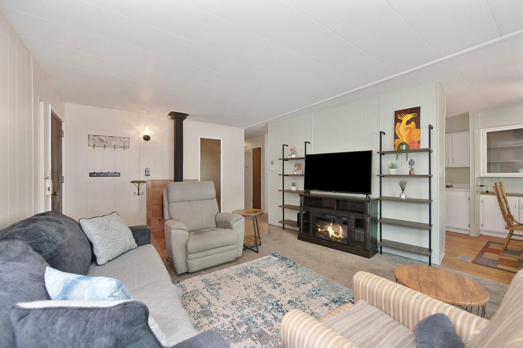 975 Amber Loop Grass Valley, CA 95945 - Photo 15 of 44 a living room with furniture and a flat screen tv