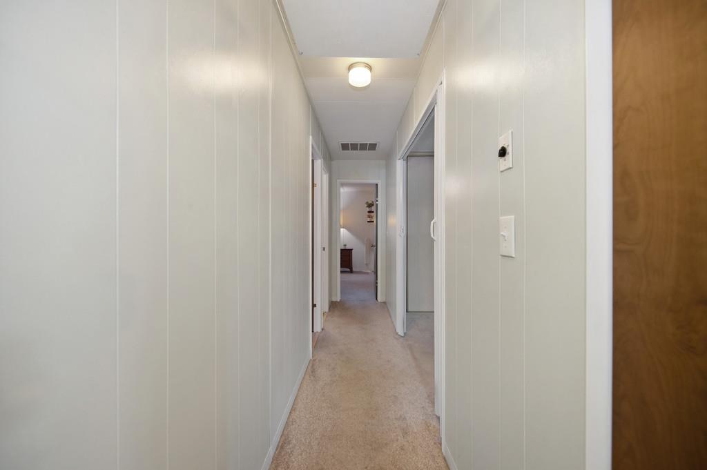 975 Amber Loop Grass Valley, CA 95945 - Photo 24 of 44 a view of a hallway with wooden shelves
