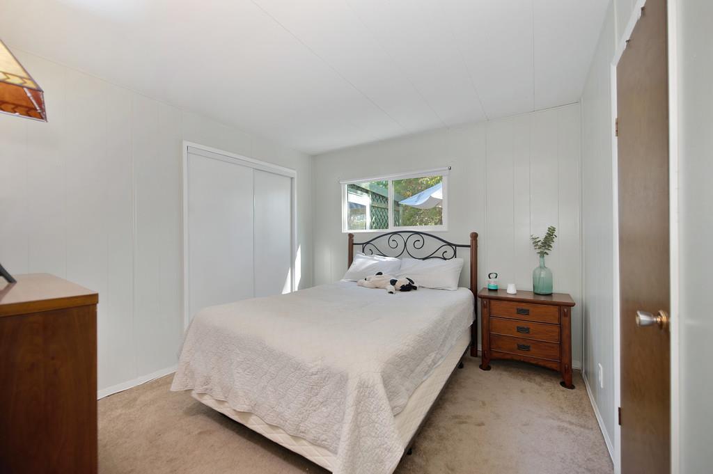 975 Amber Loop Grass Valley, CA 95945 - Photo 27 of 44 a bedroom with a bed and a window