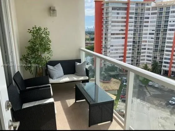 a balcony view with a seating space