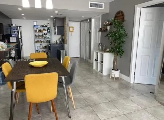 a kitchen with a table and chairs in it