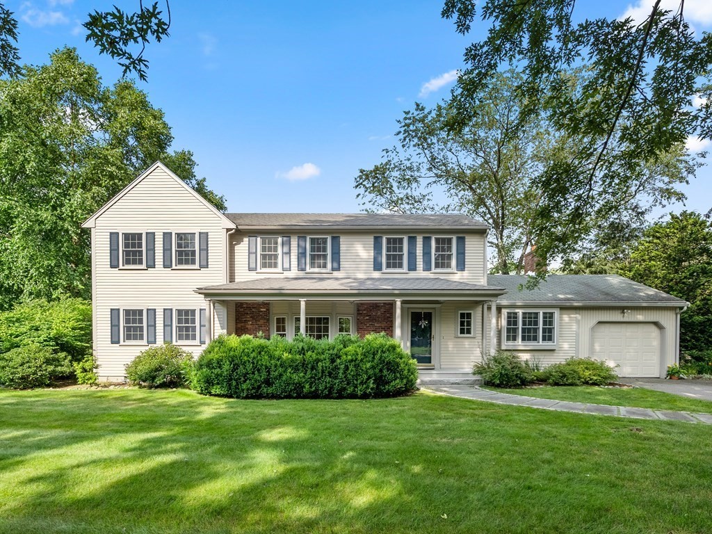 123 Victoria Road Sudbury, MA 01776 - Photo 1 of 42 a front view of a house with a garden