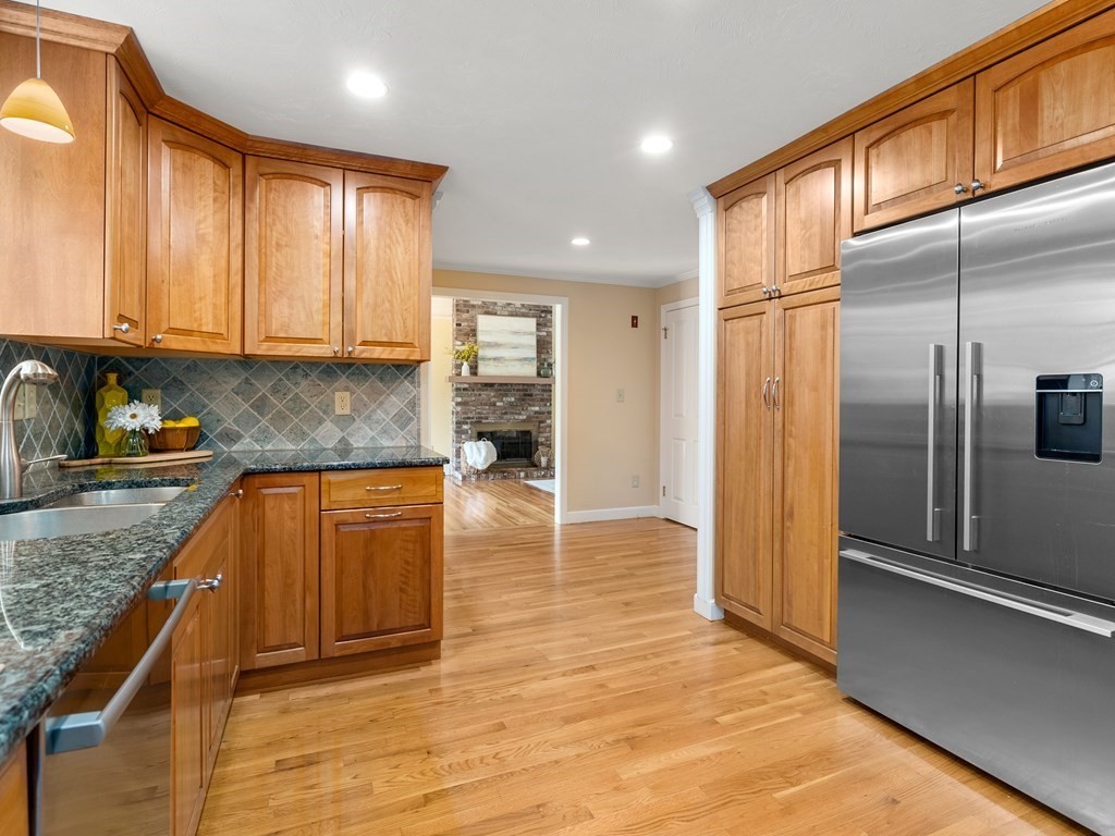 123 Victoria Road Sudbury, MA 01776 - Photo 16 of 42 a kitchen with stainless steel appliances granite countertop a refrigerator a stove and a sink