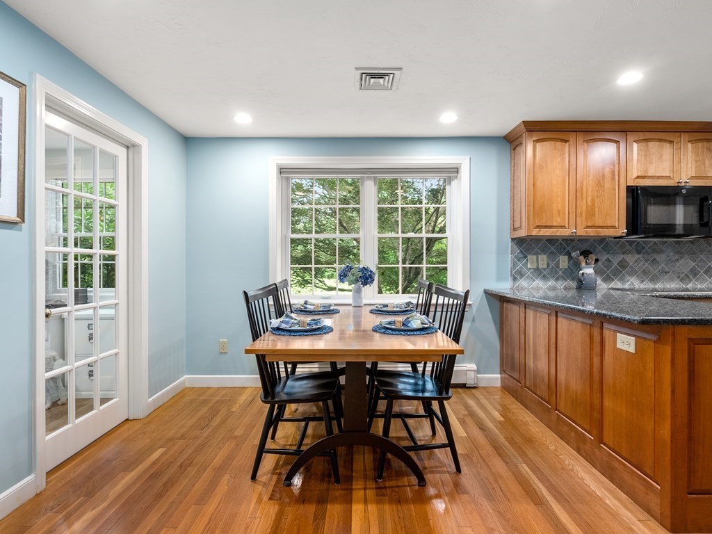 123 Victoria Road Sudbury, MA 01776 - Photo 17 of 42 a view of a a dining room with furniture window and wooden floor