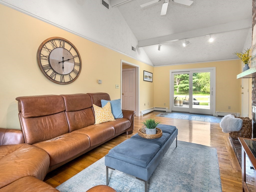 123 Victoria Road Sudbury, MA 01776 - Photo 20 of 42 a living room with furniture and a large window