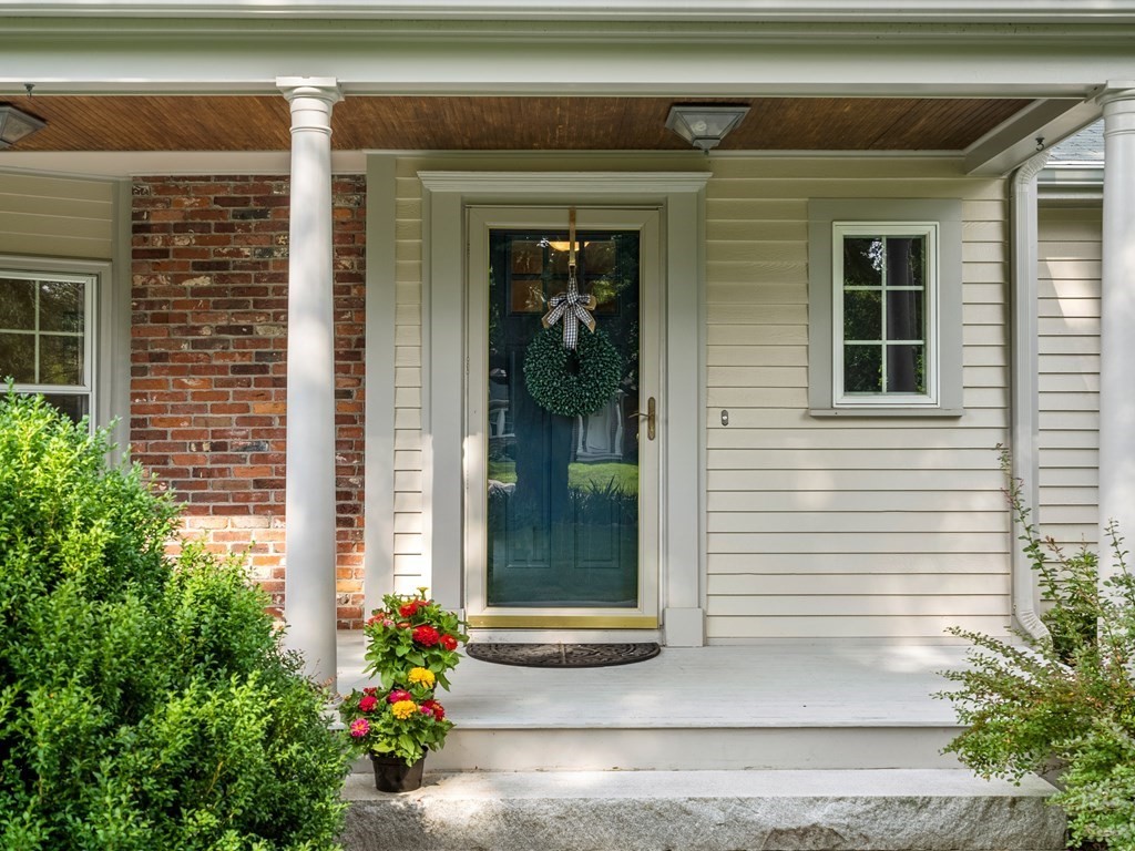 123 Victoria Road Sudbury, MA 01776 - Photo 2 of 42 a front view of a house with a porch