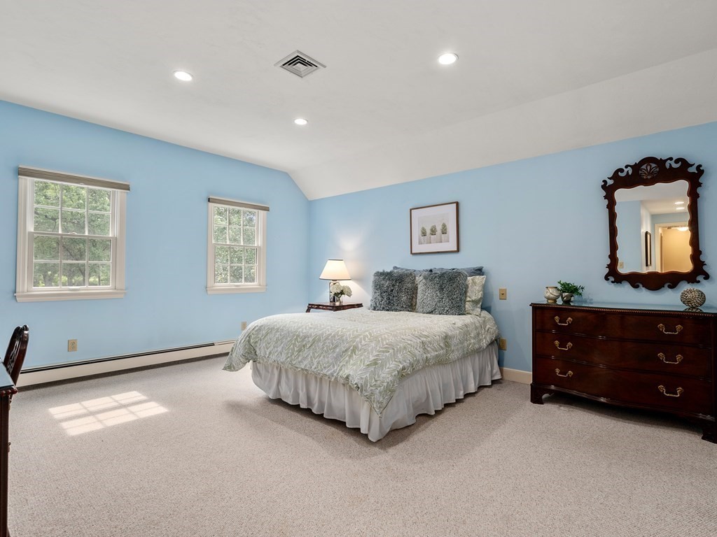 123 Victoria Road Sudbury, MA 01776 - Photo 22 of 42 a spacious bedroom with a bed and a dresser