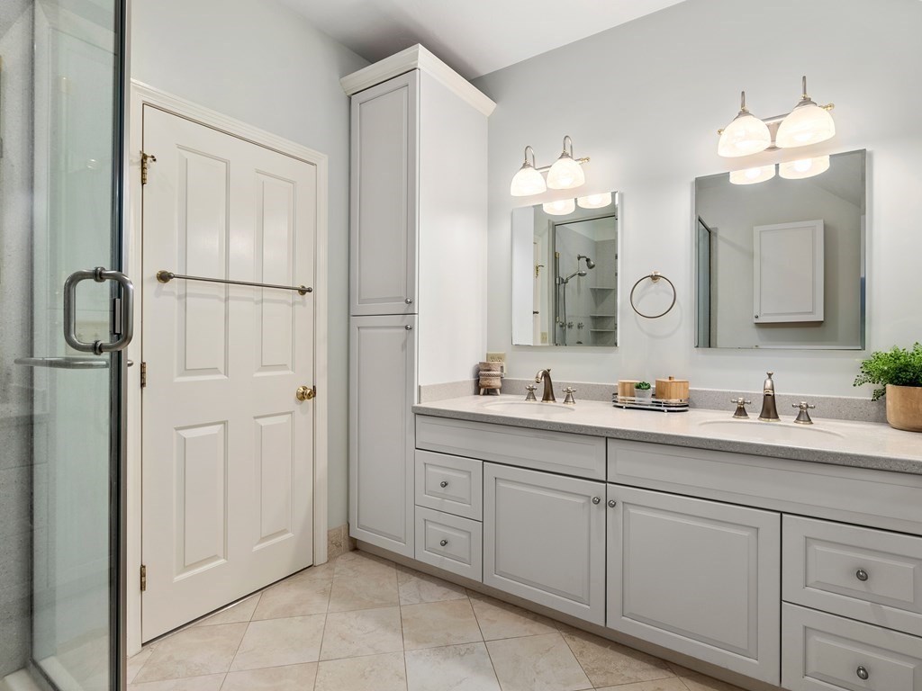 123 Victoria Road Sudbury, MA 01776 - Photo 24 of 42 a bathroom with a double vanity sink and mirror