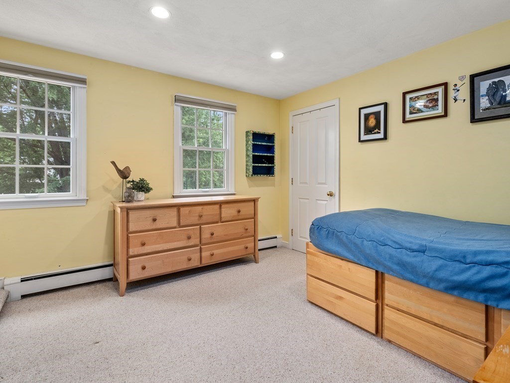 123 Victoria Road Sudbury, MA 01776 - Photo 25 of 42 a bedroom with a bed and a window