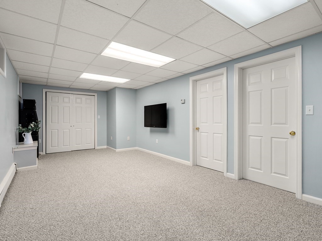 123 Victoria Road Sudbury, MA 01776 - Photo 30 of 42 a view of a livingroom with an empty space