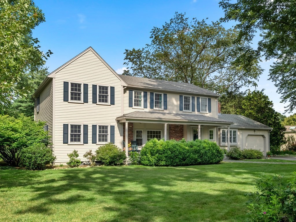 123 Victoria Road Sudbury, MA 01776 - Photo 39 of 42 a front view of a house with a garden