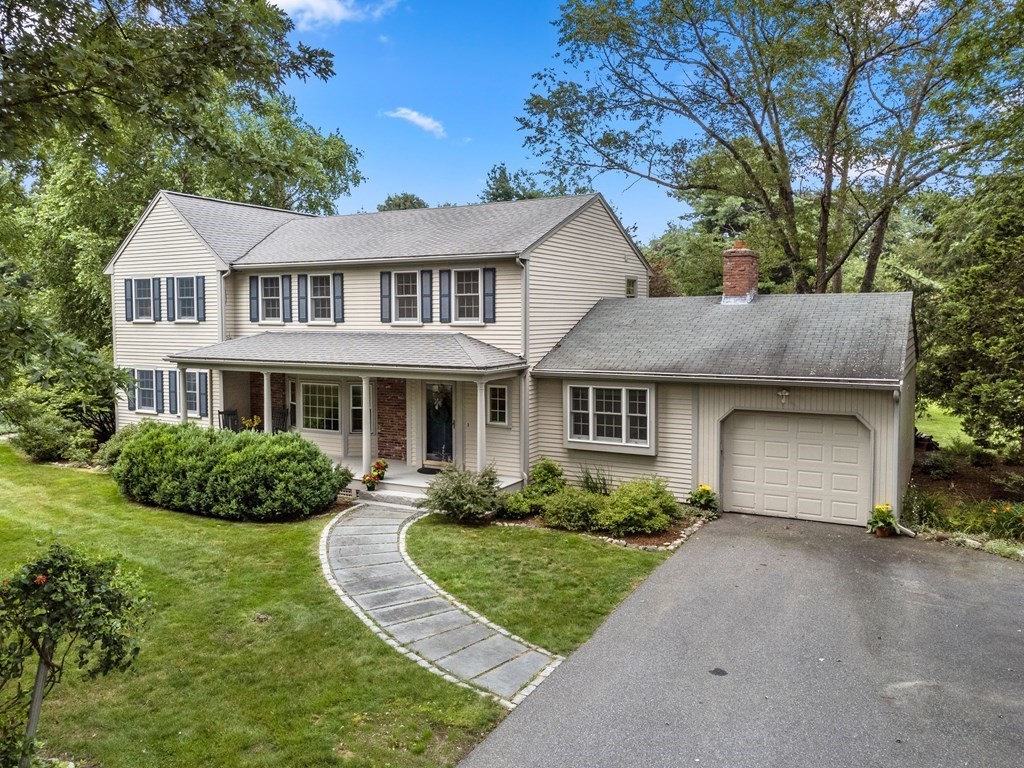 123 Victoria Road Sudbury, MA 01776 - Photo 4 of 42 a front view of a house with a yard