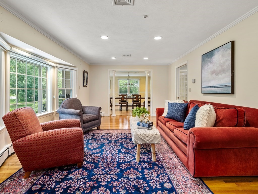 123 Victoria Road Sudbury, MA 01776 - Photo 5 of 42 a living room with furniture and a rug