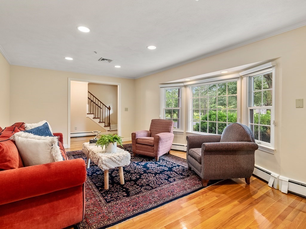 123 Victoria Road Sudbury, MA 01776 - Photo 6 of 42 a living room with furniture and a large window