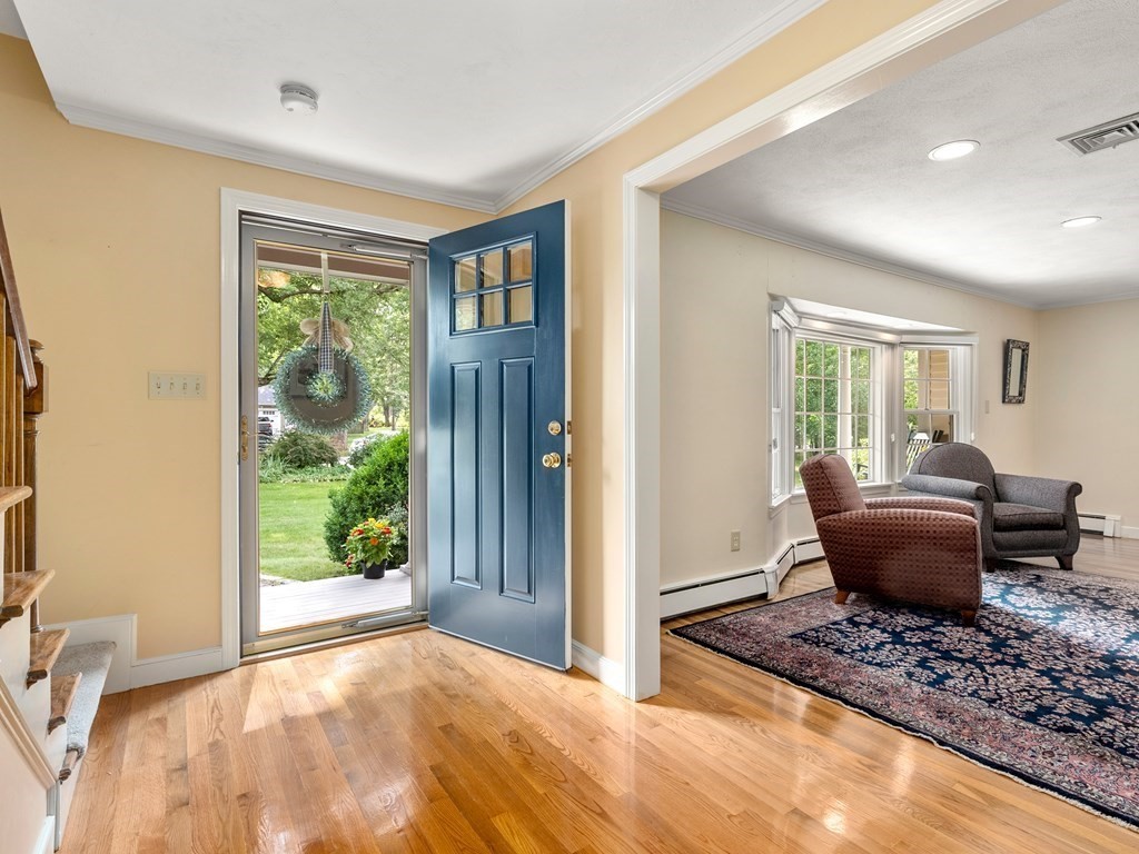 123 Victoria Road Sudbury, MA 01776 - Photo 7 of 42 a living room with furniture and a window