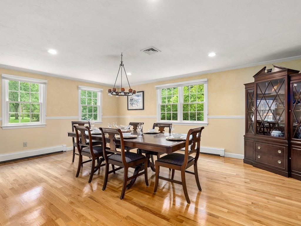 123 Victoria Road Sudbury, MA 01776 - Photo 9 of 42 a view of a dining room with furniture window and wooden floor