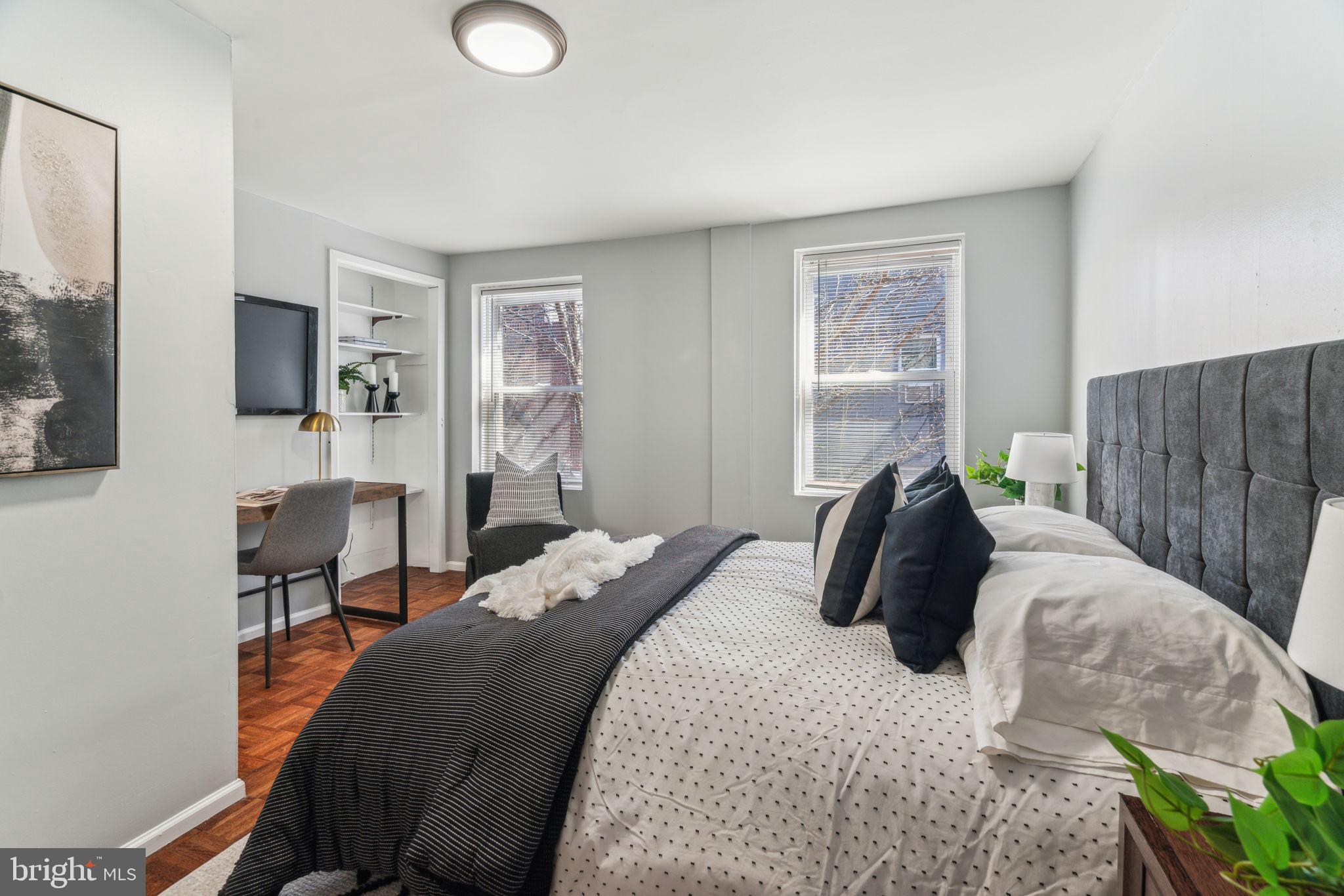 1314 South Warnock Street Philadelphia, PA 19147 - Photo 11 of 24 a bedroom with a bed and flat screen tv