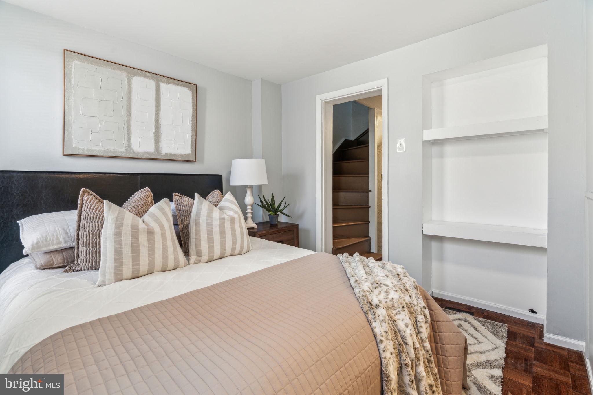 1314 South Warnock Street Philadelphia, PA 19147 - Photo 16 of 24 a bedroom with a bed and window