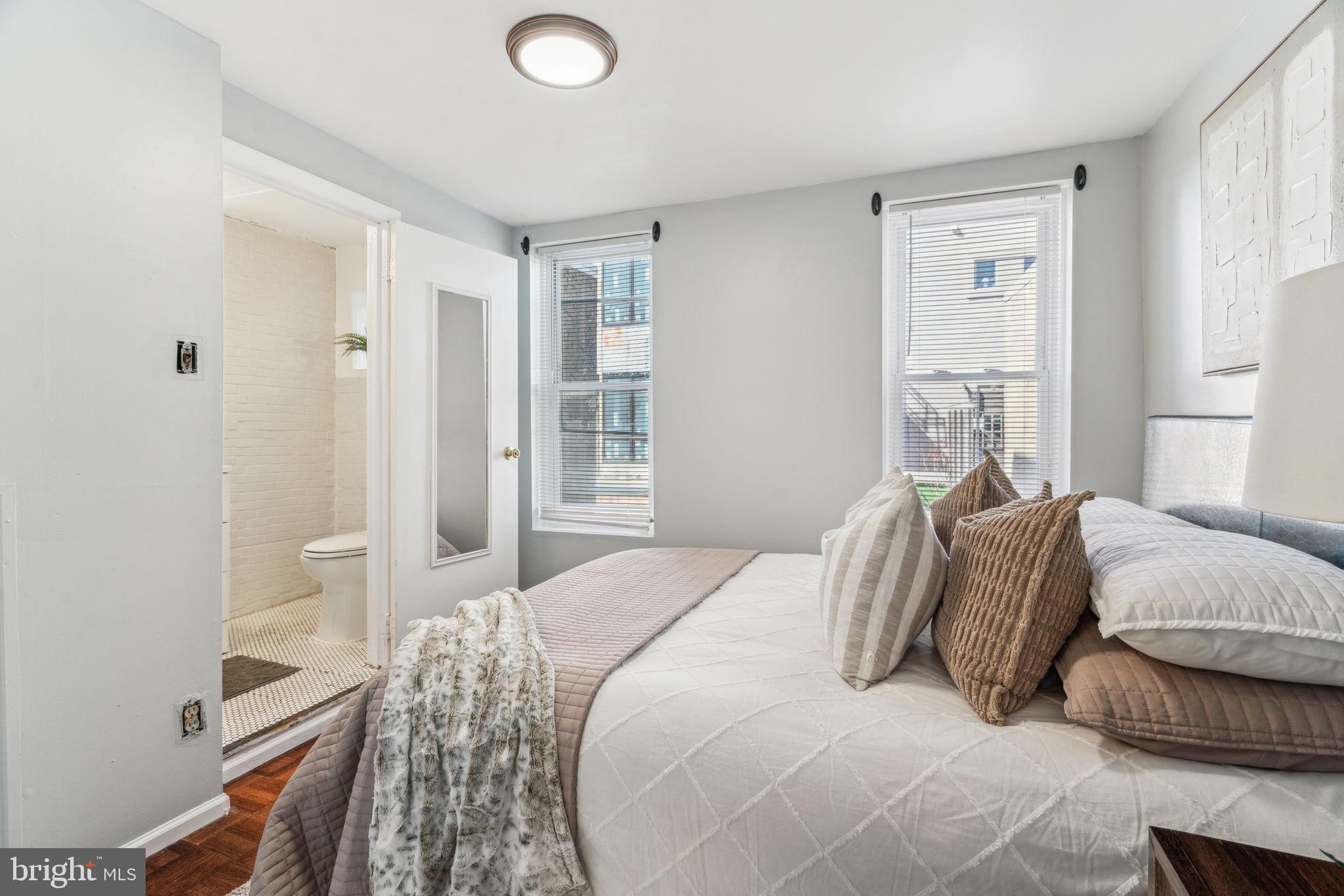 1314 South Warnock Street Philadelphia, PA 19147 - Photo 17 of 24 a bedroom with a bed and a window