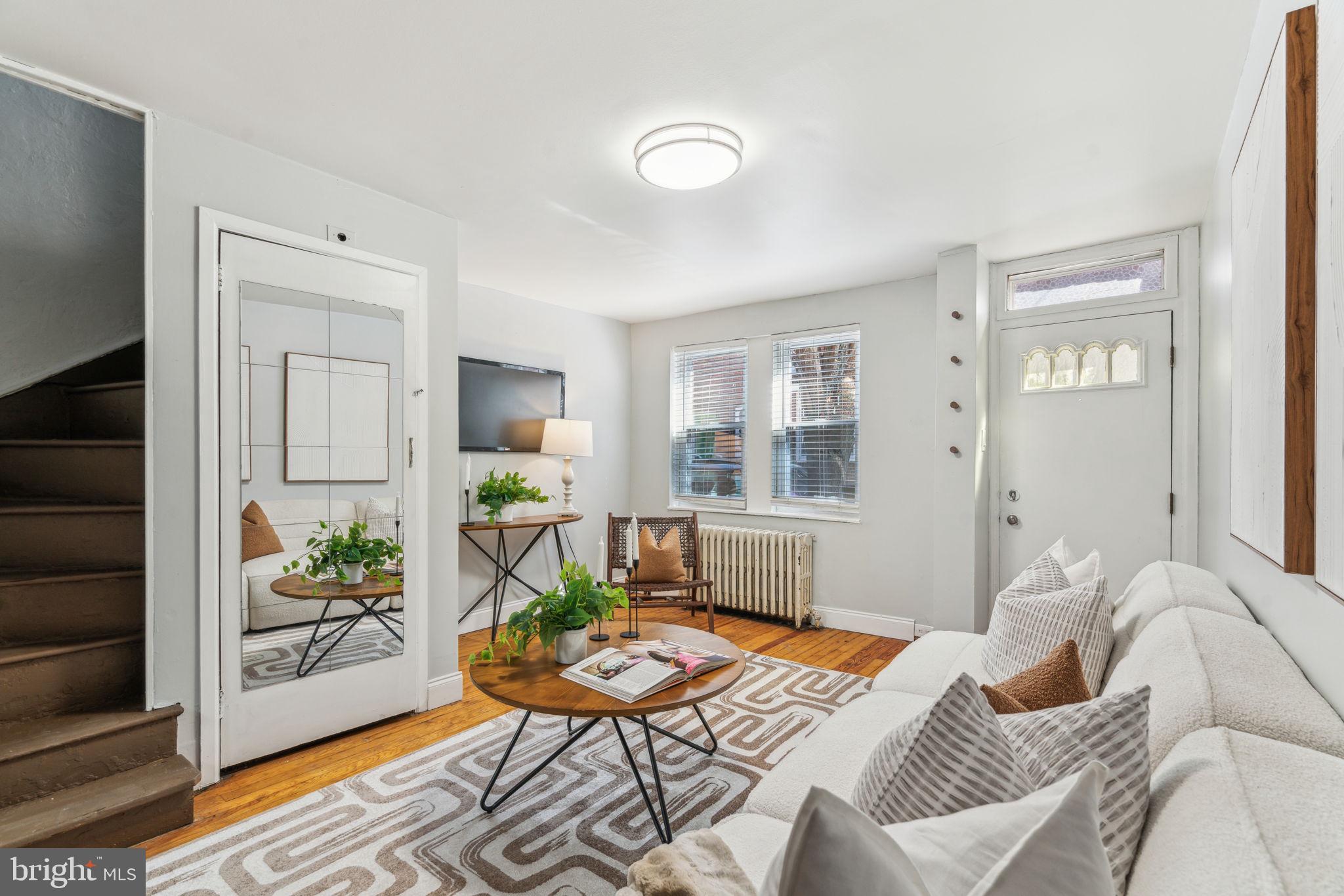 1314 South Warnock Street Philadelphia, PA 19147 - Photo 2 of 24 a living room with furniture and wooden floor