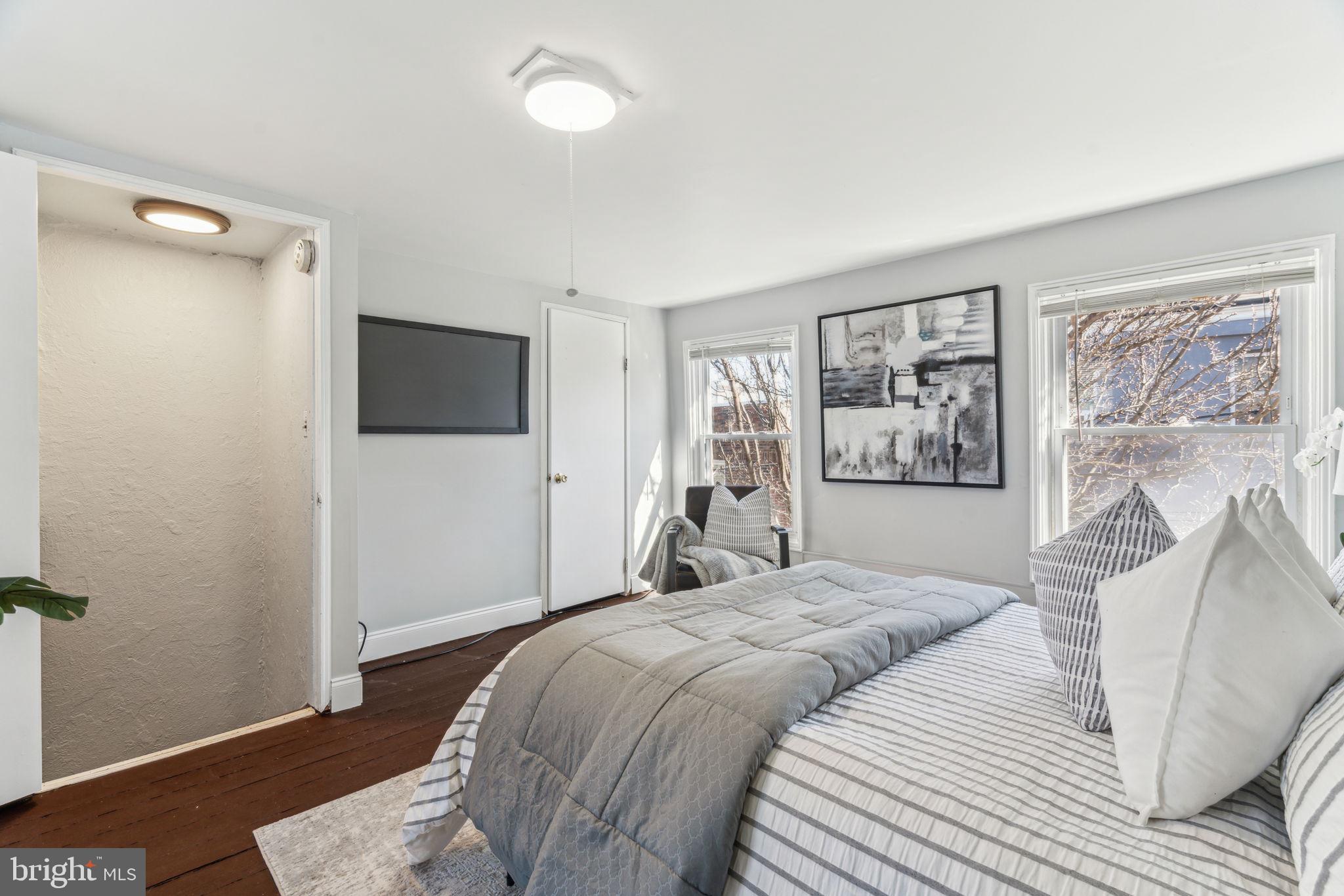 1314 South Warnock Street Philadelphia, PA 19147 - Photo 23 of 24 a bedroom with a bed and a flat screen tv