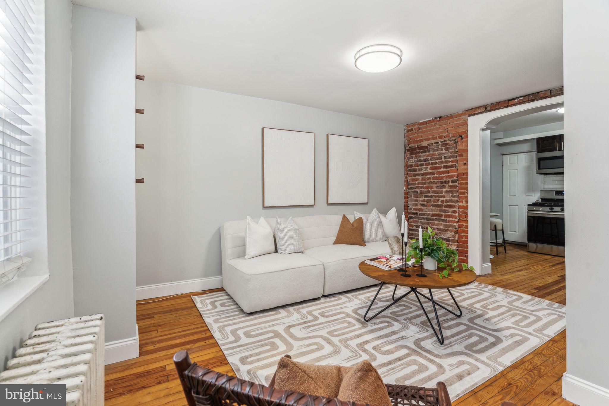 1314 South Warnock Street Philadelphia, PA 19147 - Photo 4 of 24 a living room with furniture and wooden floor