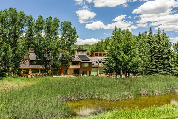 a view of a house with a big yard