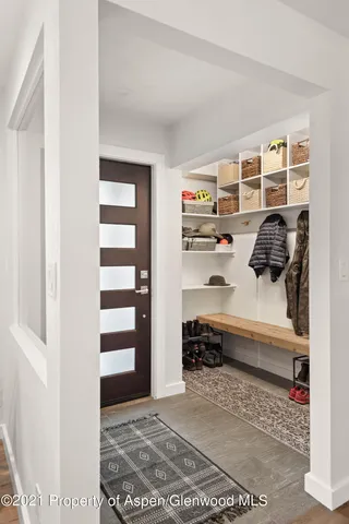 a bedroom with a bed and a closet