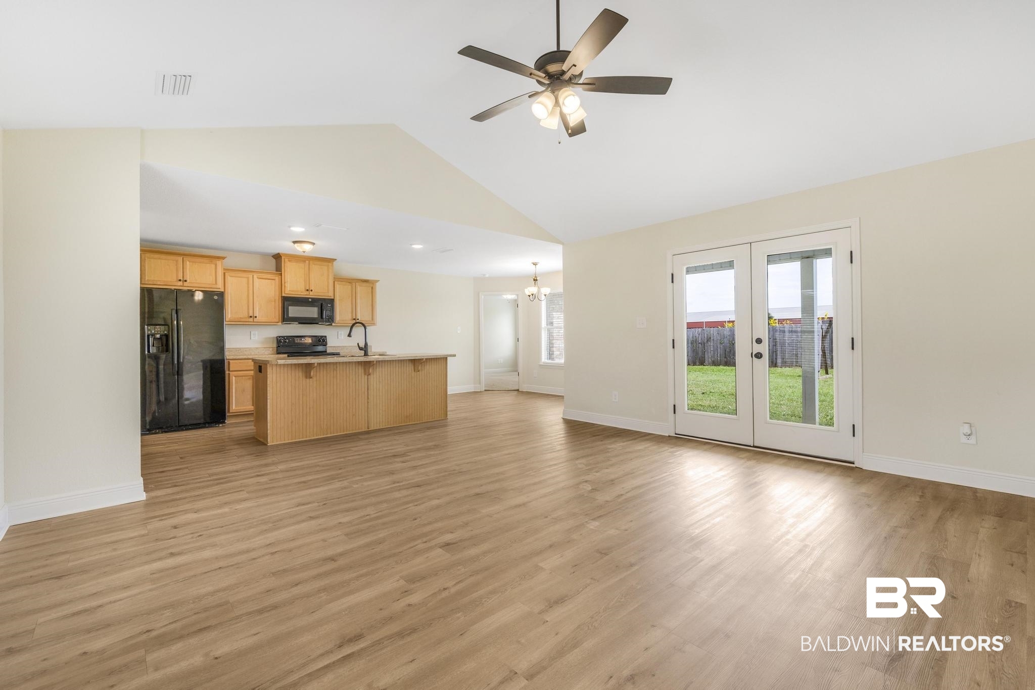 21580 Talbot Lane Robertsdale, AL 36567 - Photo 24 of 25 Kitchen featuring open floor plan, black appliances, light brown cabinetry, ceiling fan, and light wood-style floors