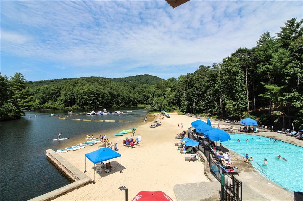 8088 Ridgeview Drive Big Canoe, GA 30143 - Photo 18 of 30 a view of a lake with a yard and a terrace