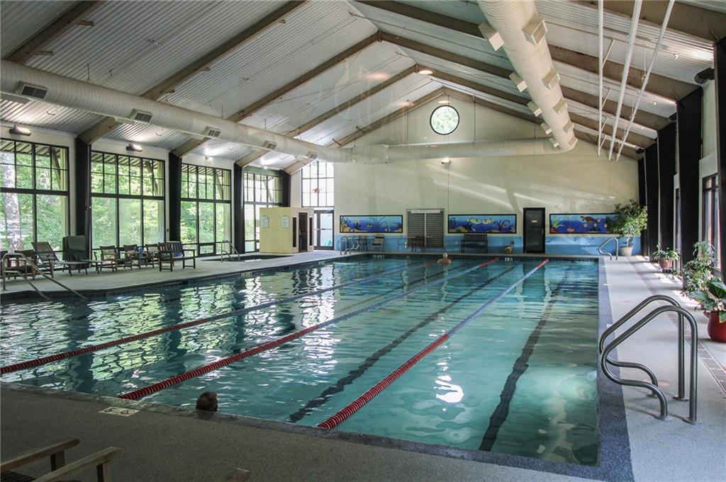 8088 Ridgeview Drive Big Canoe, GA 30143 - Photo 21 of 30 a room with lots of table and chairs