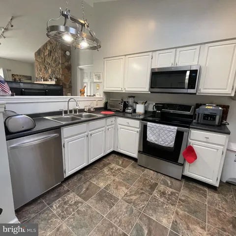 a room with wooden floor and furniture