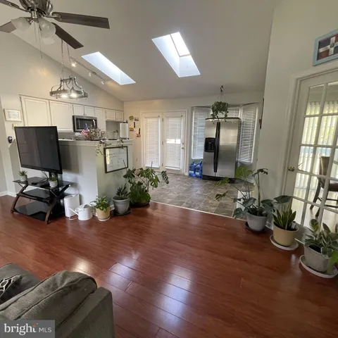 a kitchen with stainless steel appliances granite countertop a refrigerator and a stove