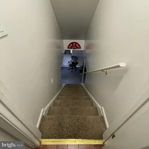 a view of a house with a window and wooden door