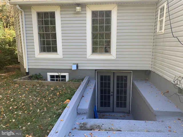 a view of a chairs and table in the balcony