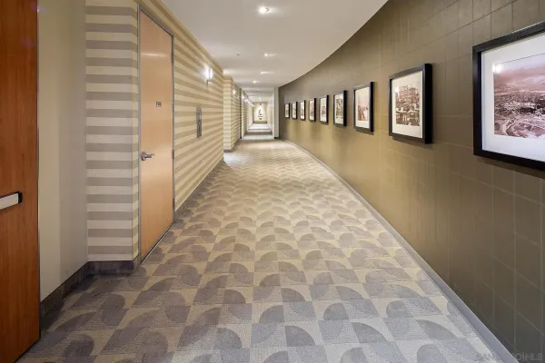 a view of a hallway with windows