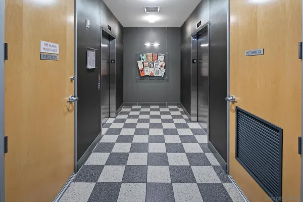 a view of a bathroom with a black and white checkered floor