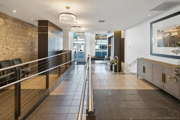 a lobby with furniture and window