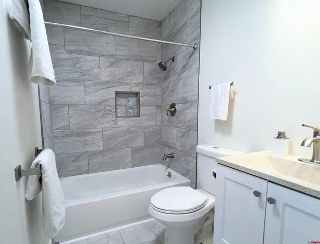 a bathroom with a sink a toilet and a bathtub