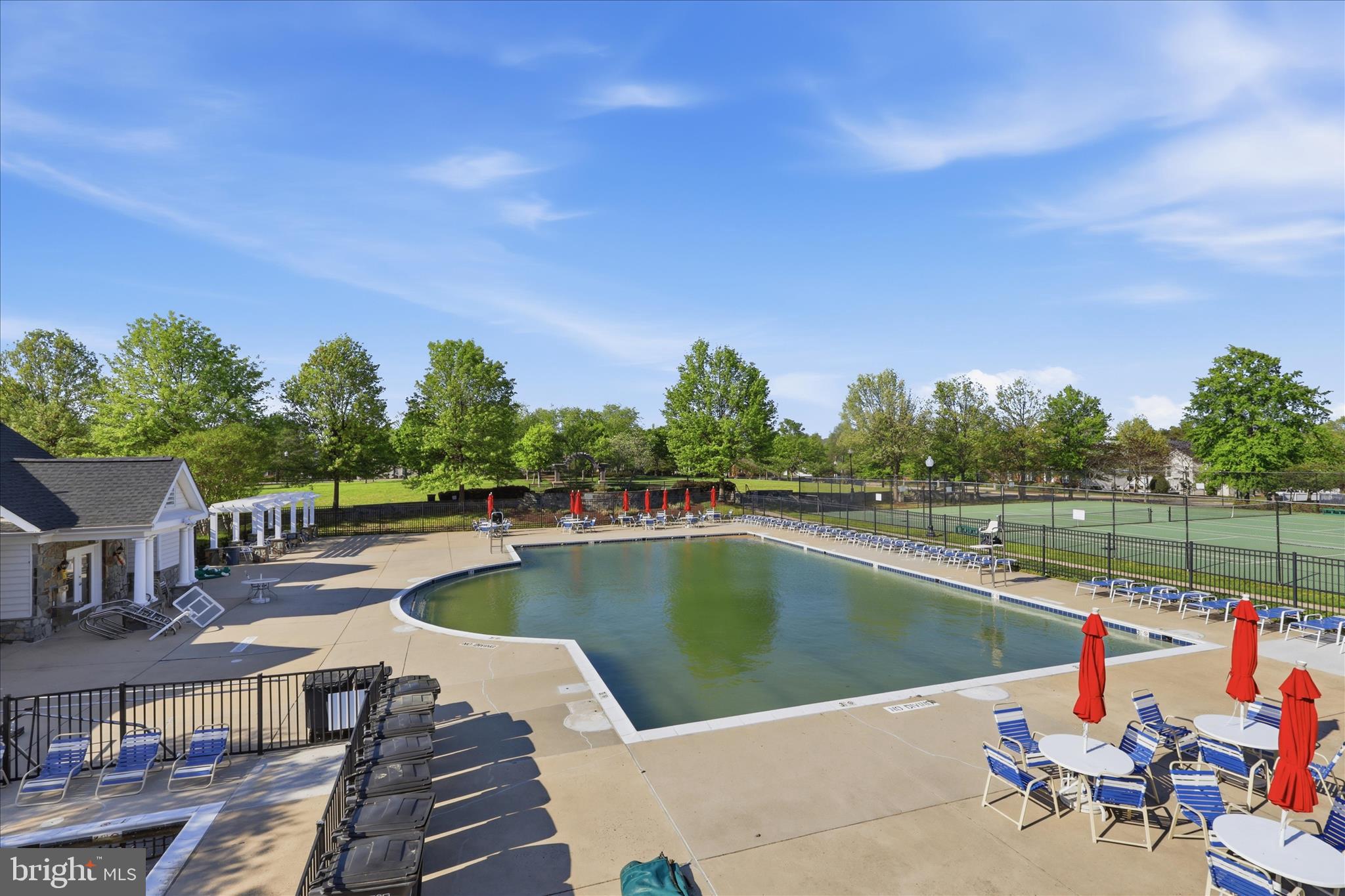 25352 Ripleys Field Drive Chantilly, VA 20152 - Photo 40 of 54 a view of a lake with a table and chairs